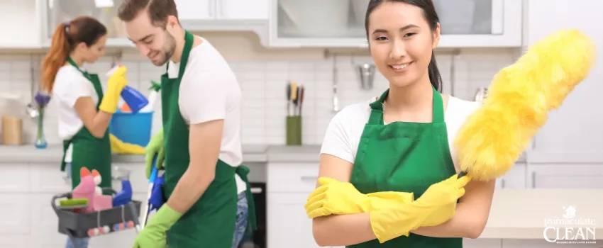 IC - A team of professional cleaners cleaning a kitchen