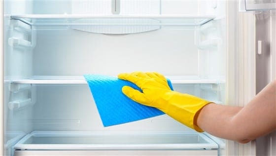 cleaning a fridge